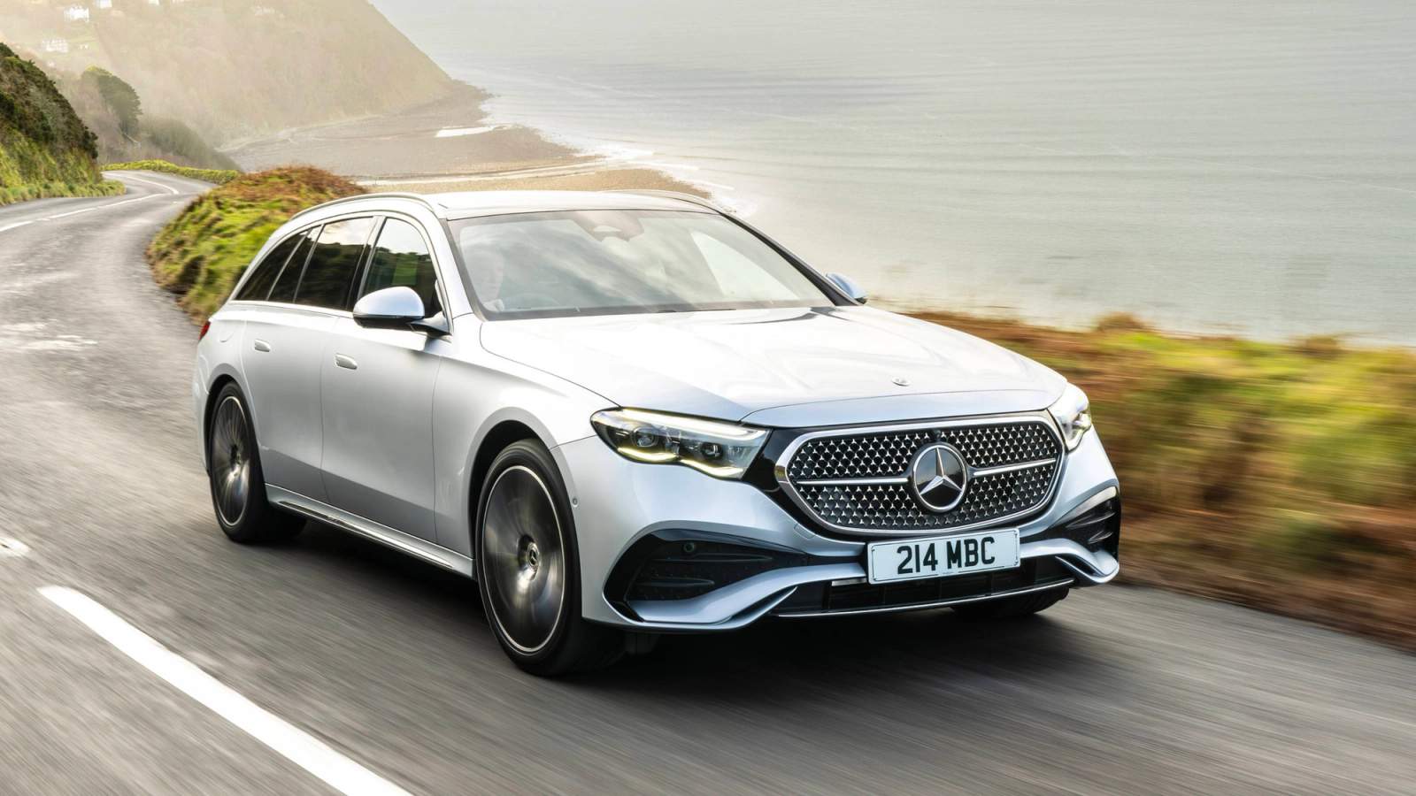 Silver Mercedes-Benz E-Class driving