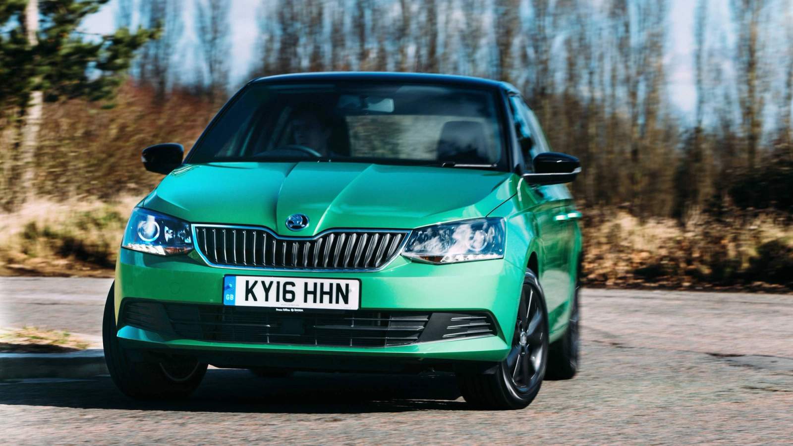 Green Skoda Fabia cornering
