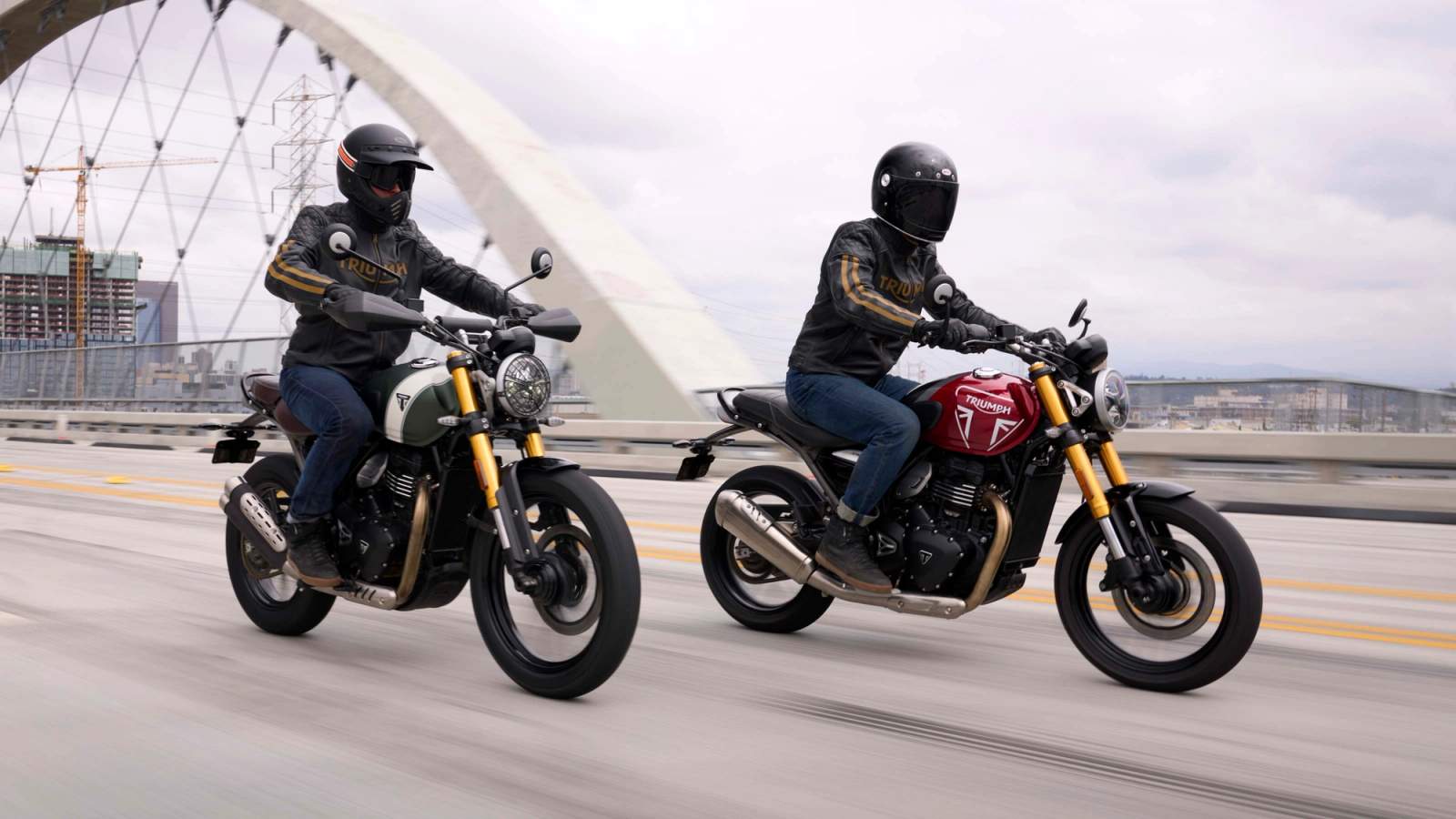 Triumph Speed 400 and Scrambler 400X driving across a bridge