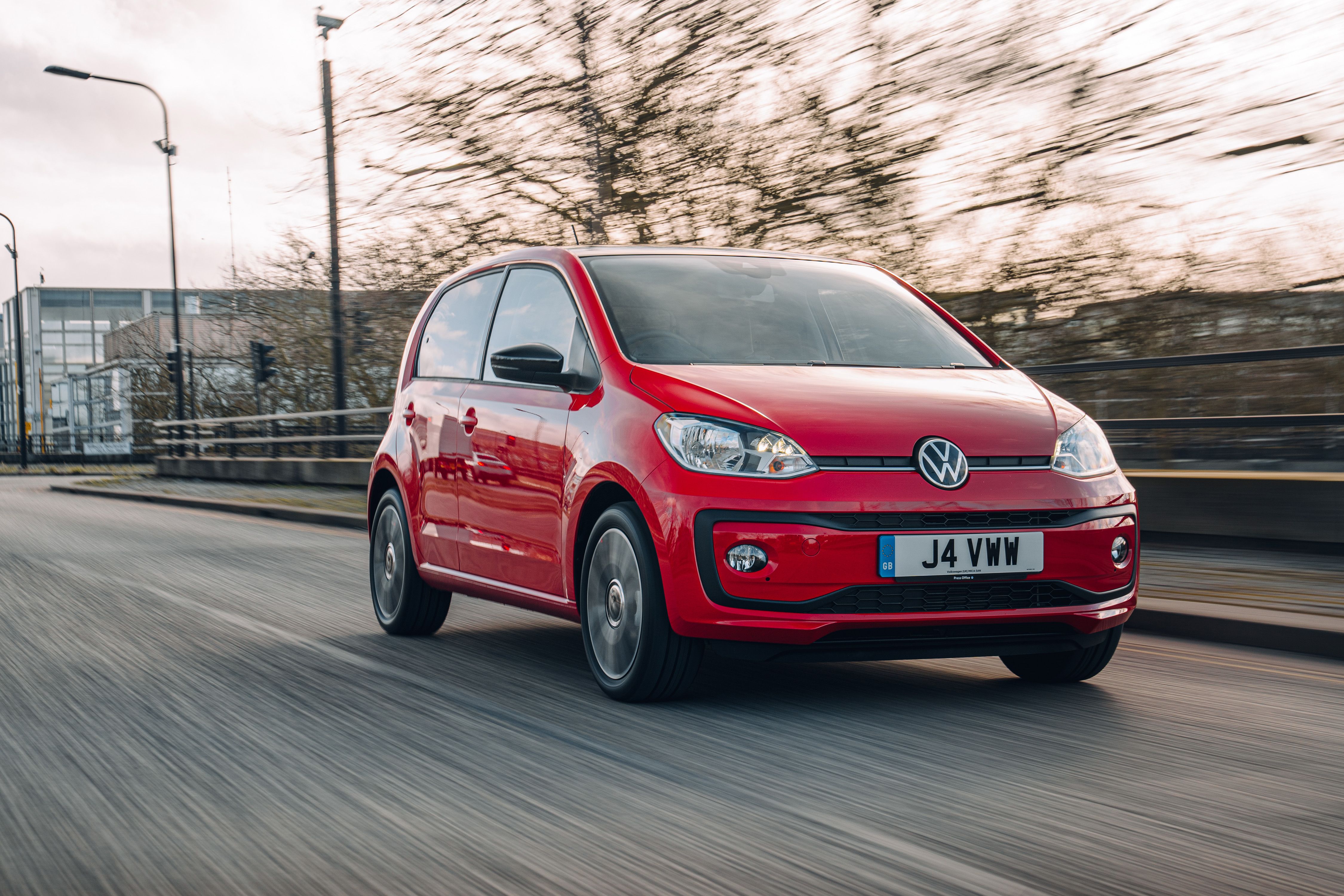Red Volkswagen Up! driving