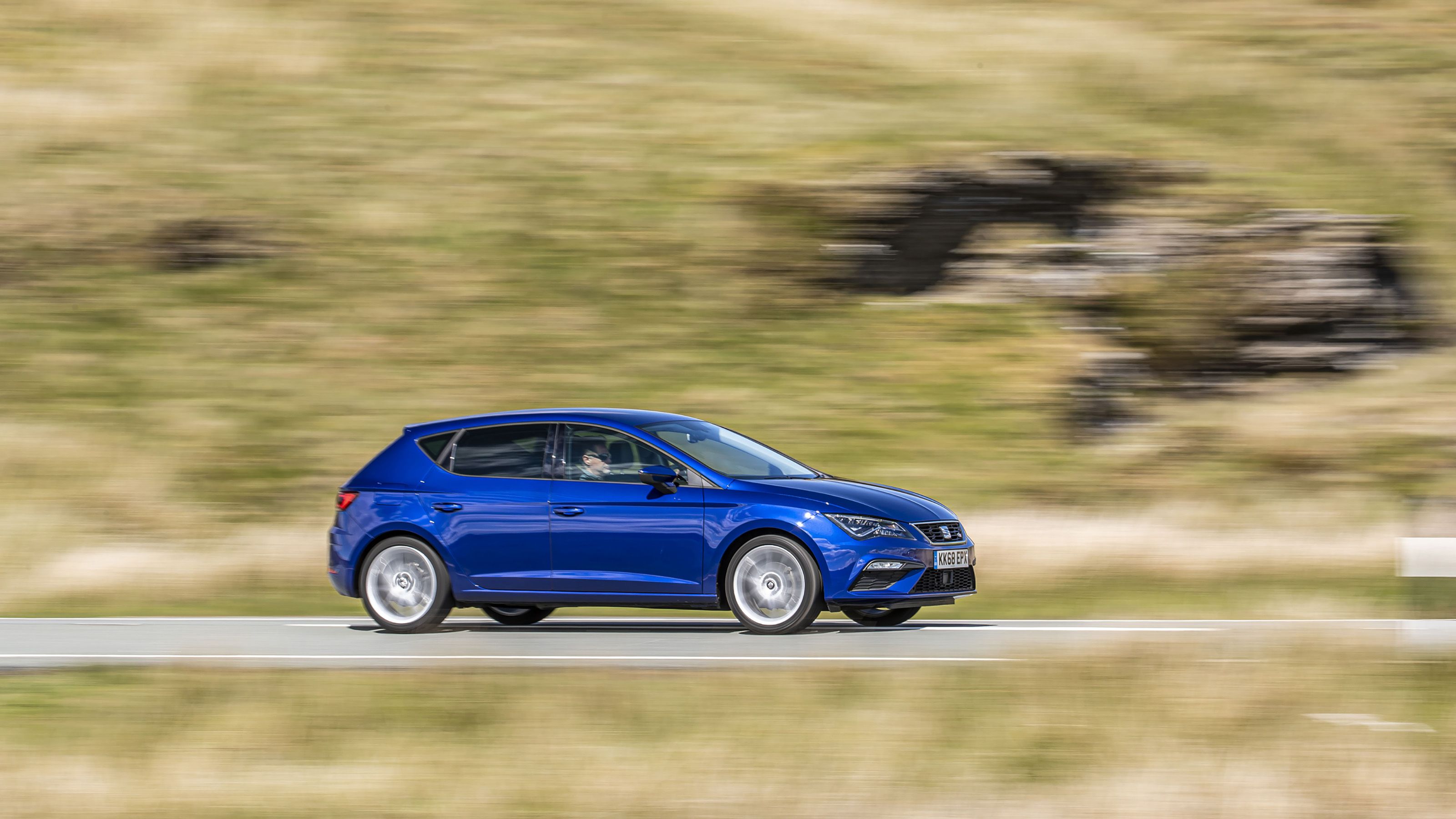 Blue Seat Leon side driving