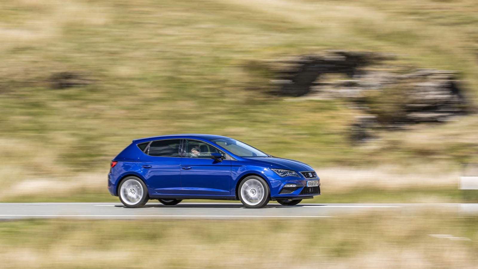 Blue Seat Leon side driving