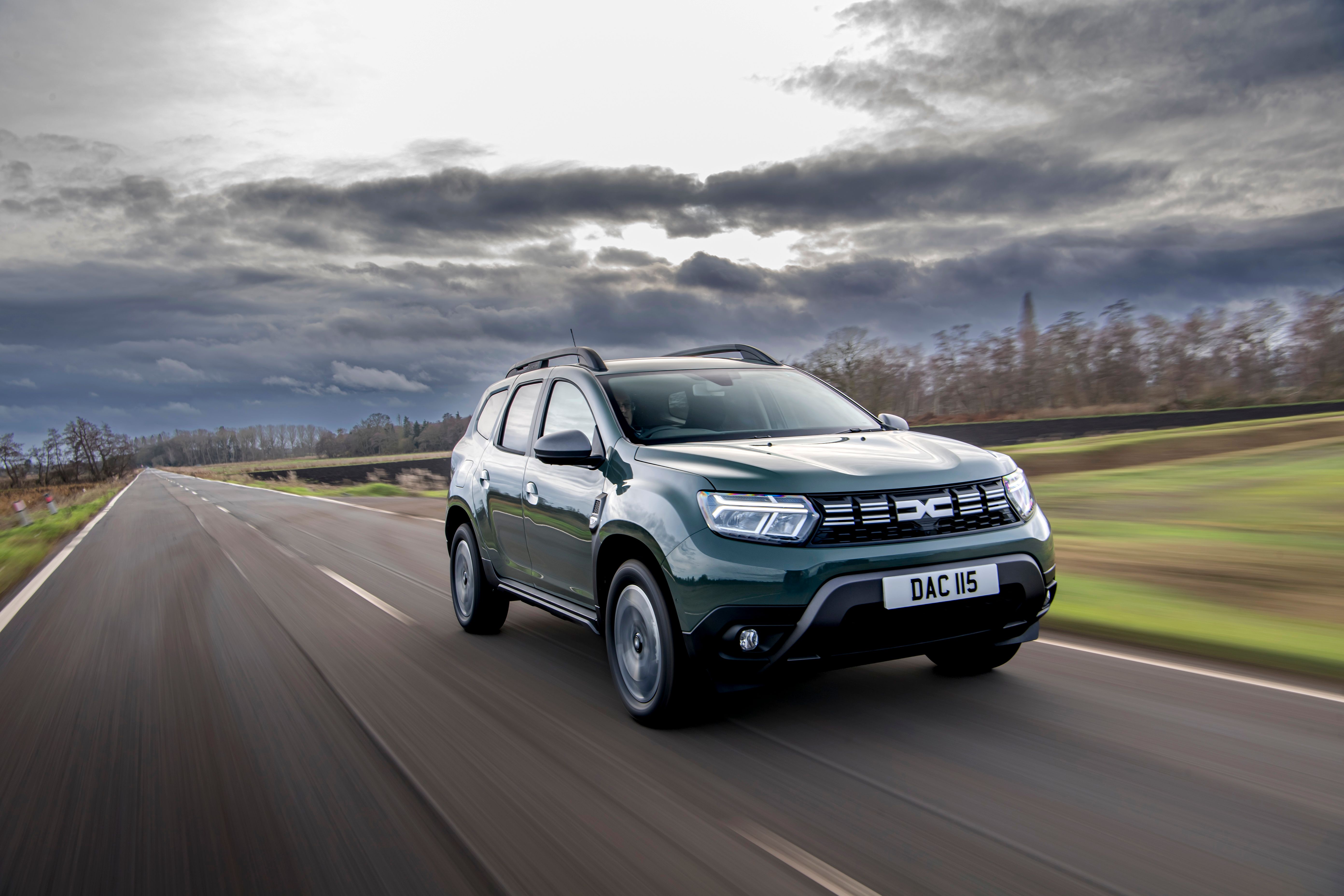 Green Dacia Duster driving