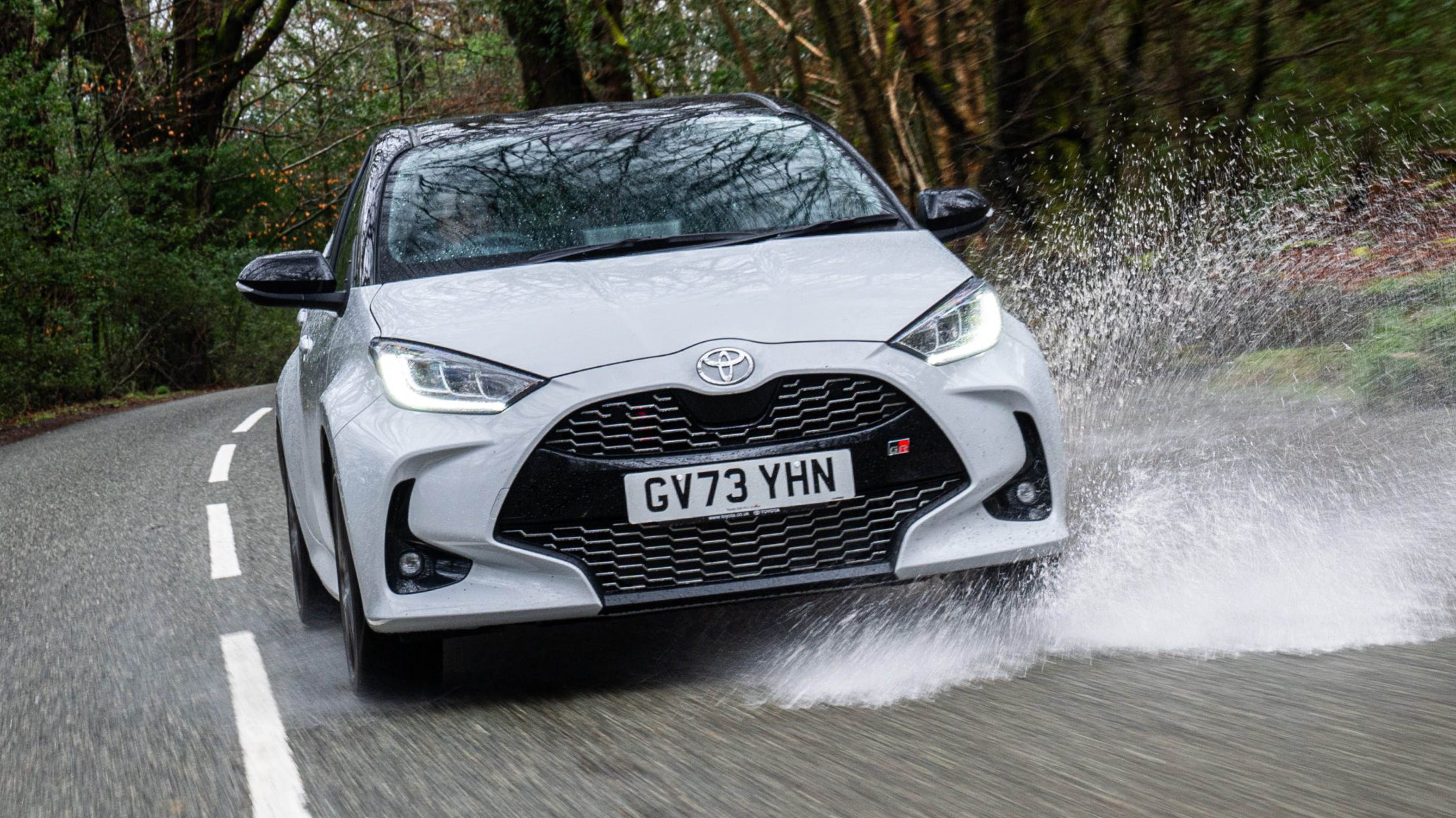 Toyota Yaris GR Sport driving through a puddle