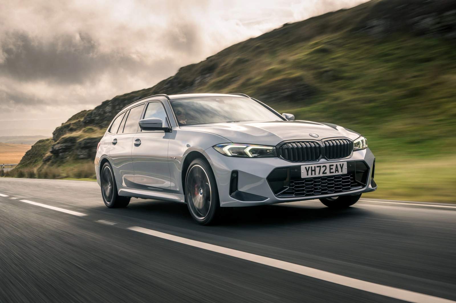 Grey BMW 3 Series Touring driving