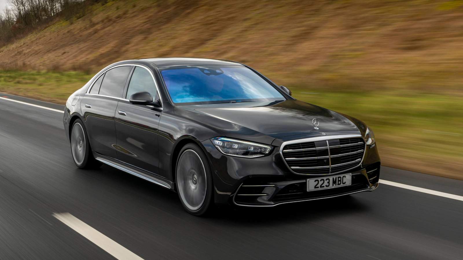 Black Mercedes-Benz S-Class driving