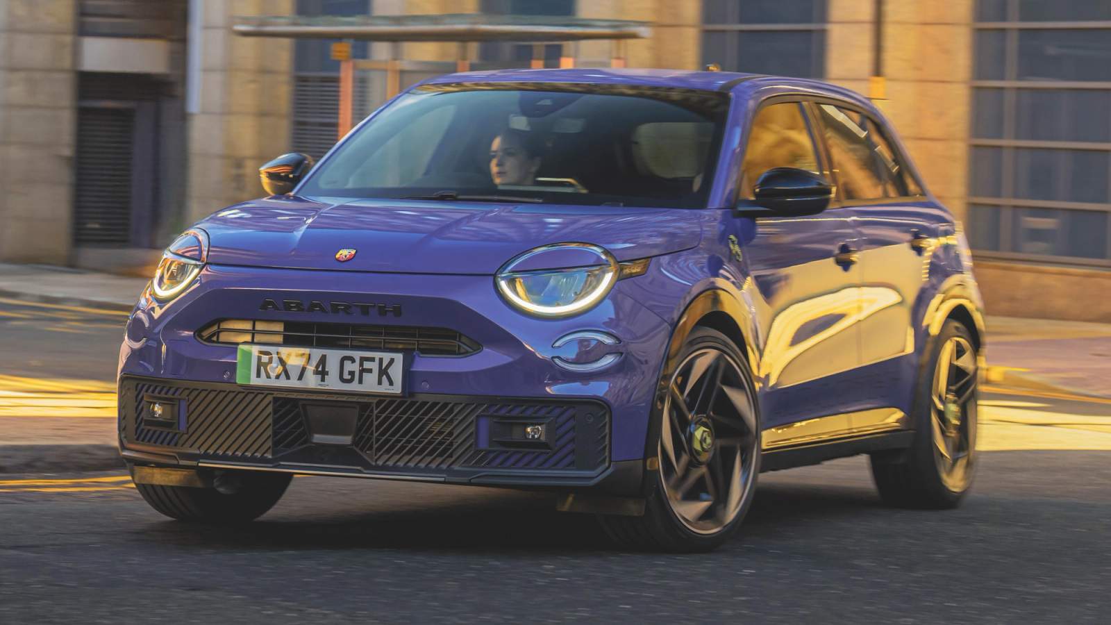 Abarth 600e driving around town