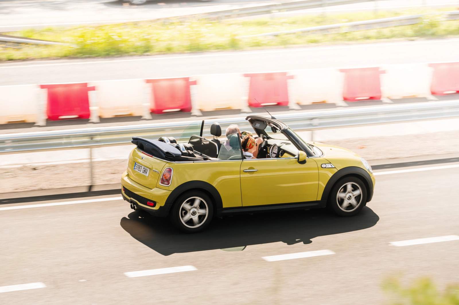 yellow car on the road