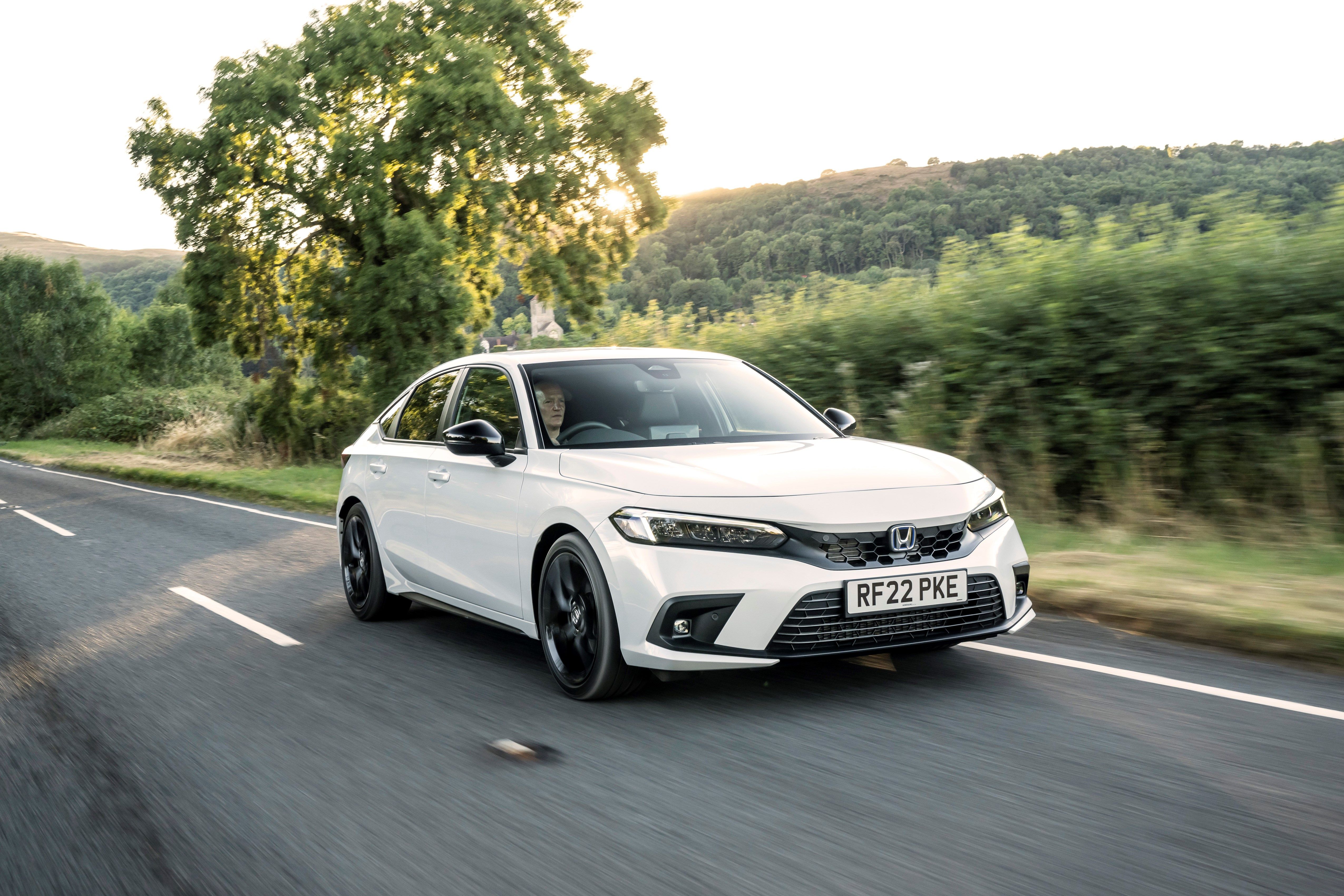 White Honda Civic driving