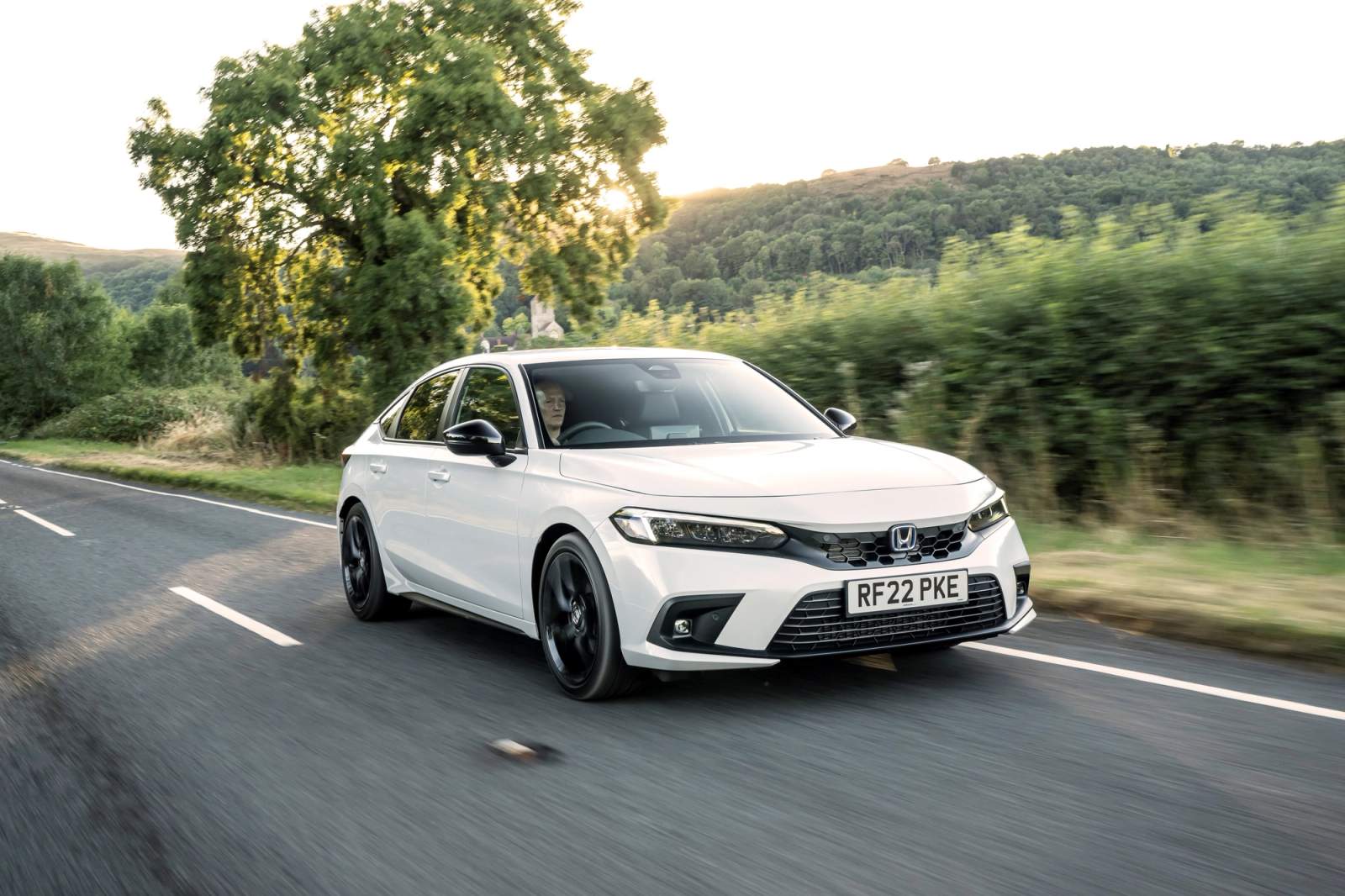 White Honda Civic driving