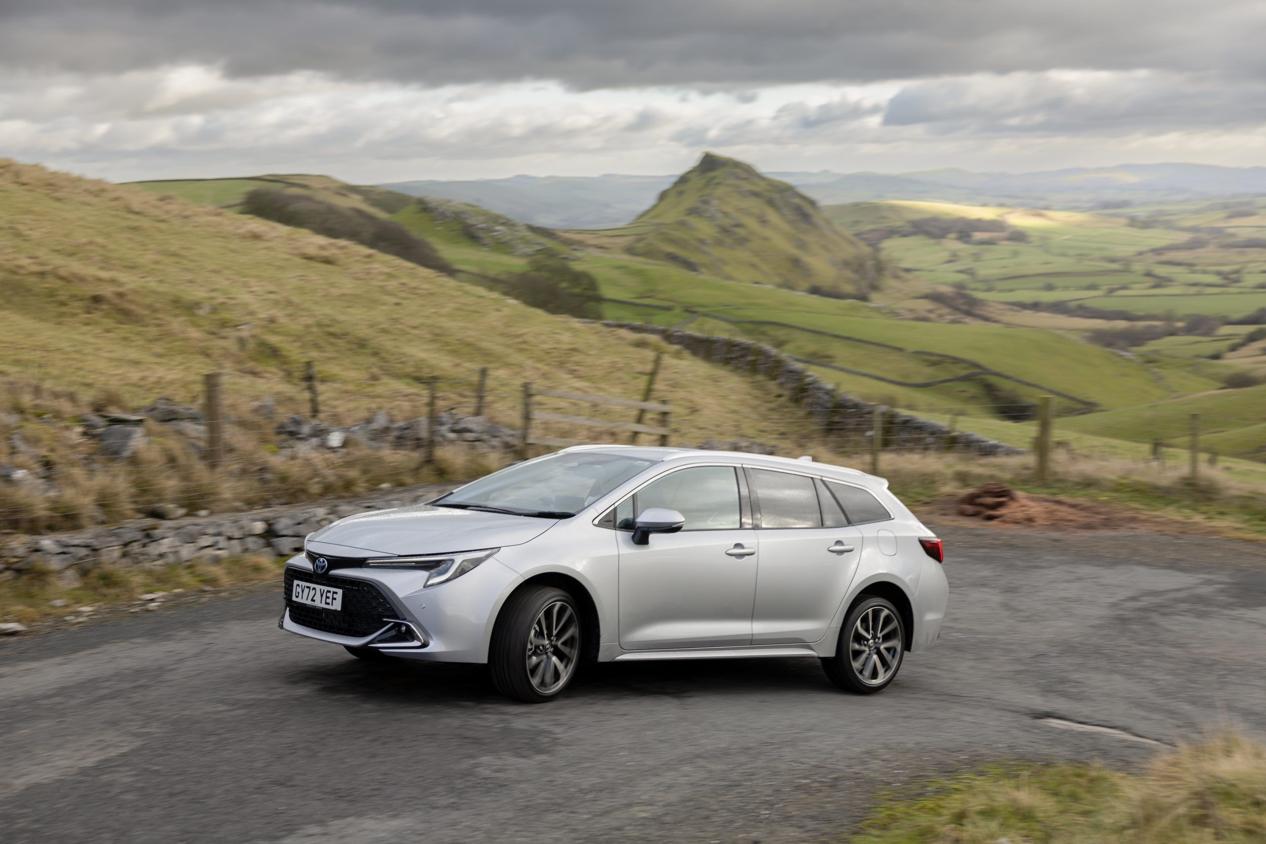 Silver Toyota Corolla Touring Sports driving