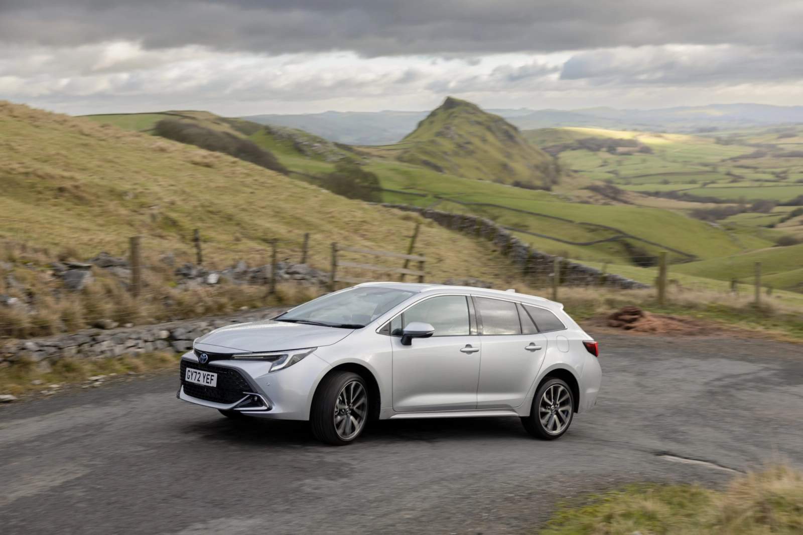 Silver Toyota Corolla Touring Sports driving