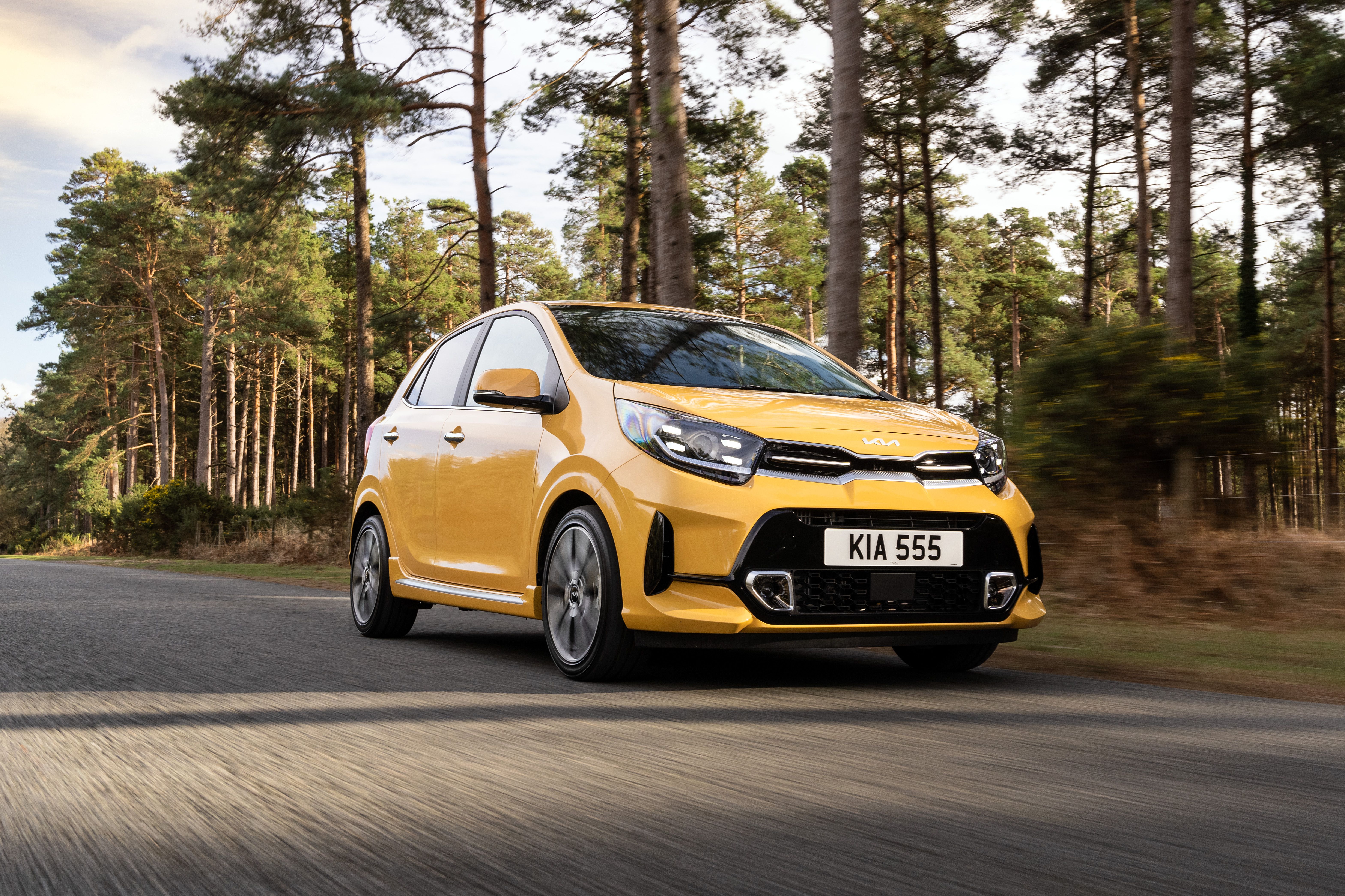 Yellow Kia Picanto driving