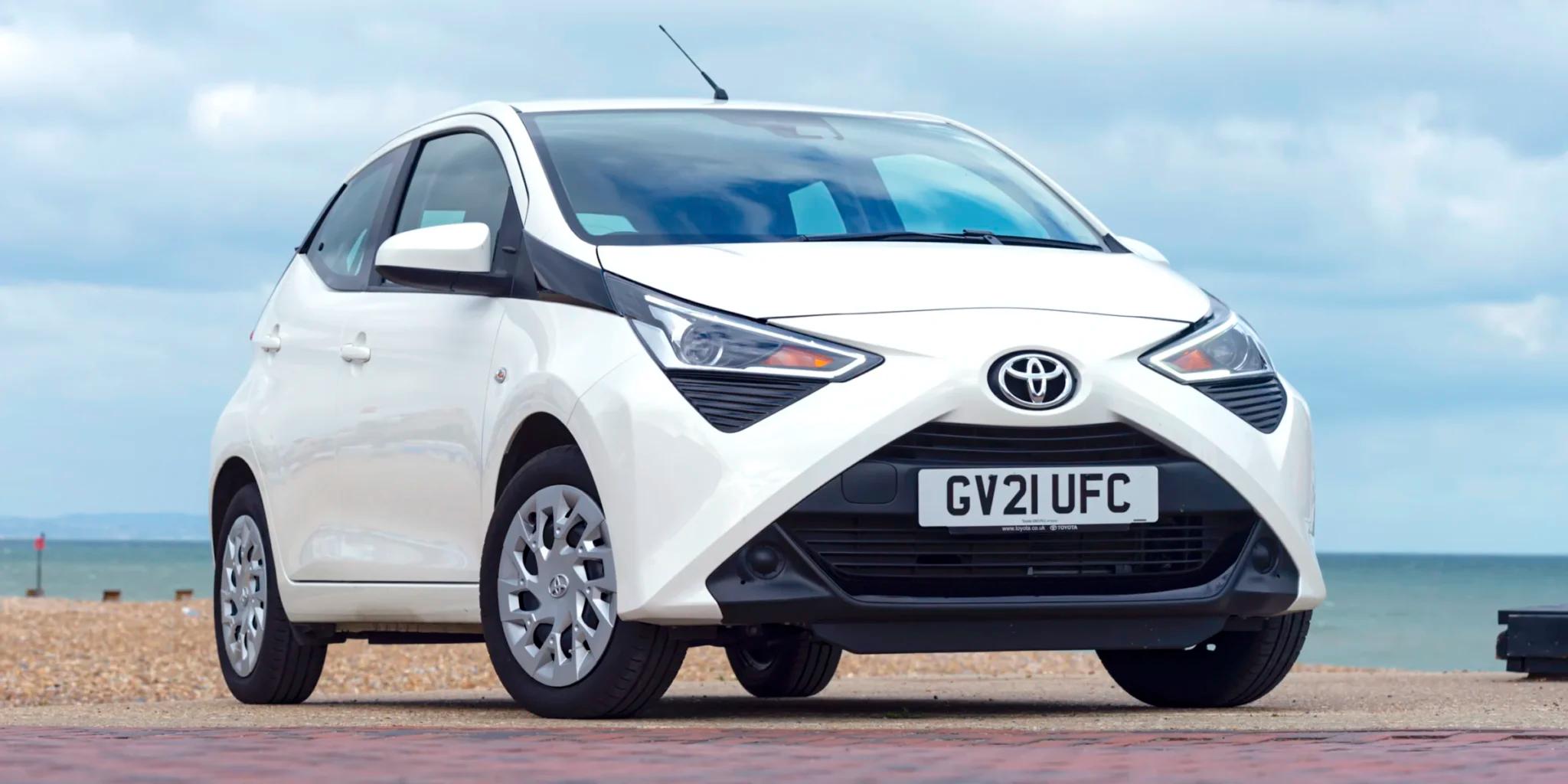 white car parked near the sea