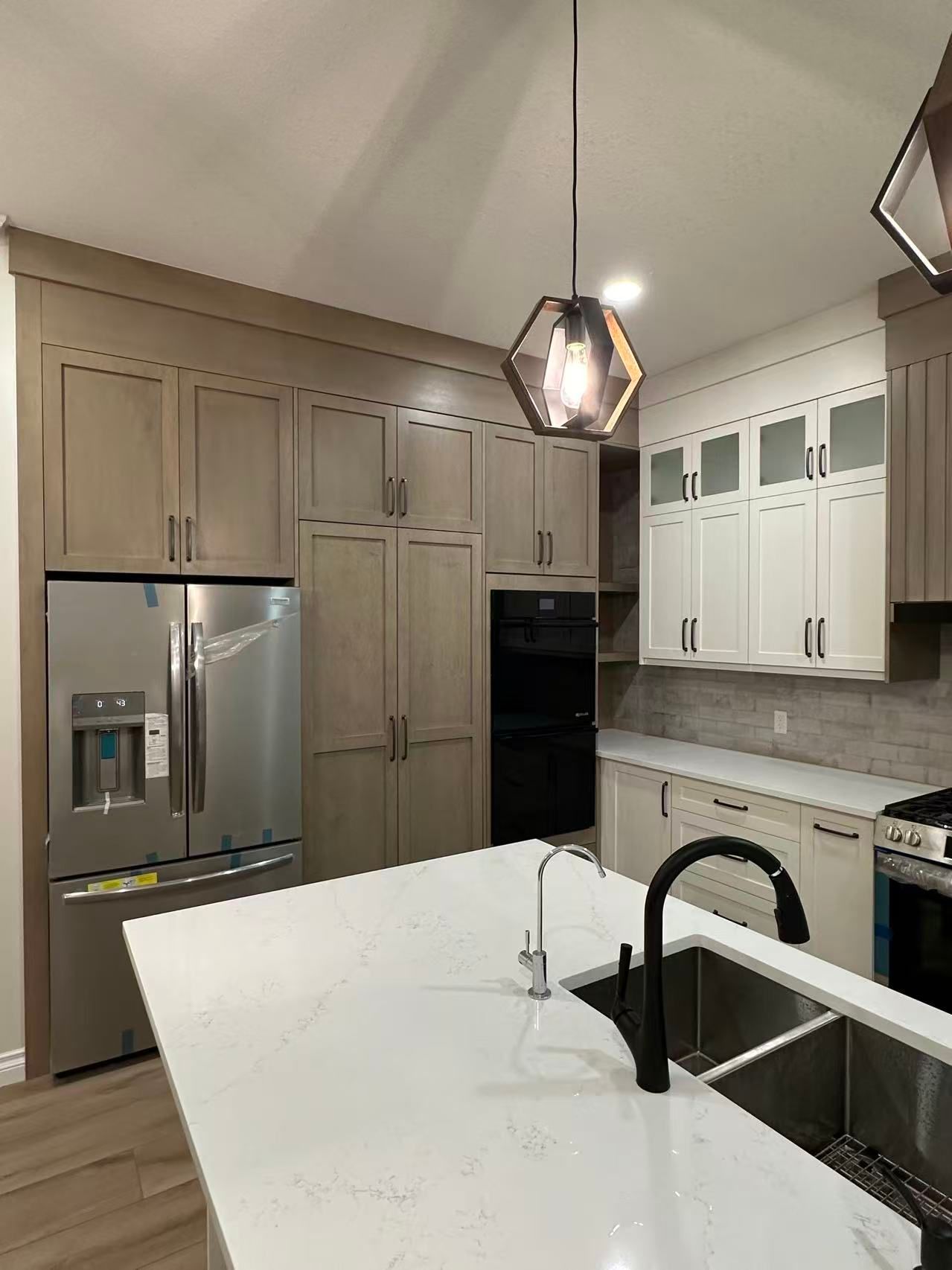Custom kitchen renovation Calgary with high-end appliances quartz countertops and designer cabinetry