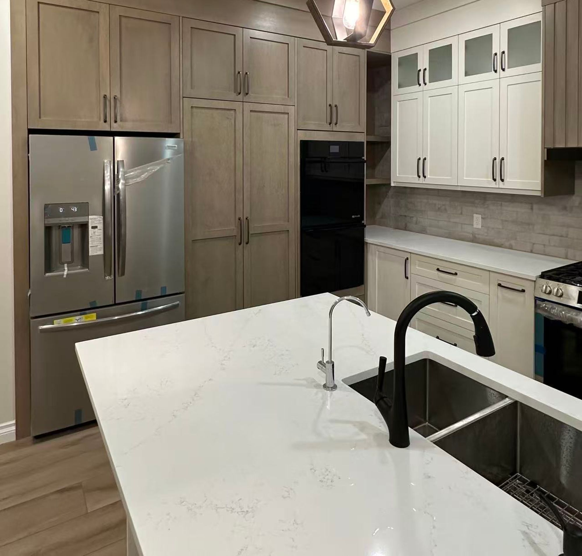 Custom kitchen renovation Calgary with high-end appliances quartz countertops and designer cabinetry