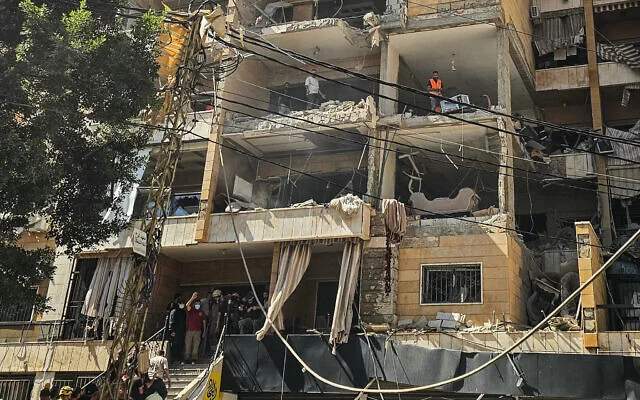 Emergency responders examining damaged building in Beirut Dahieh district after Israeli airstrike on June 7 2026