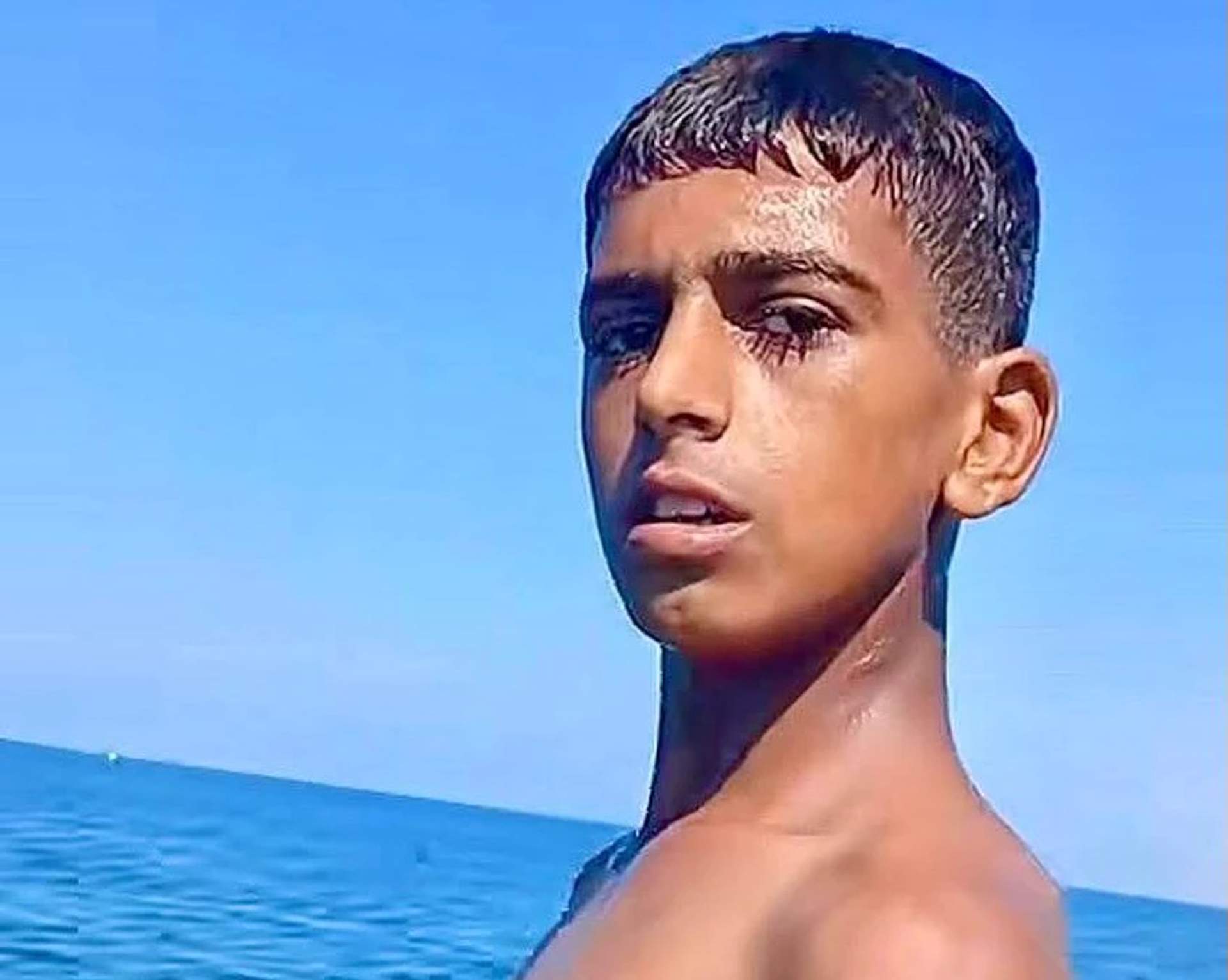 Young Palestinian fisherman Muhammad Musa Abu Giab, on the beach of Deir al-Balah in central Gaza.