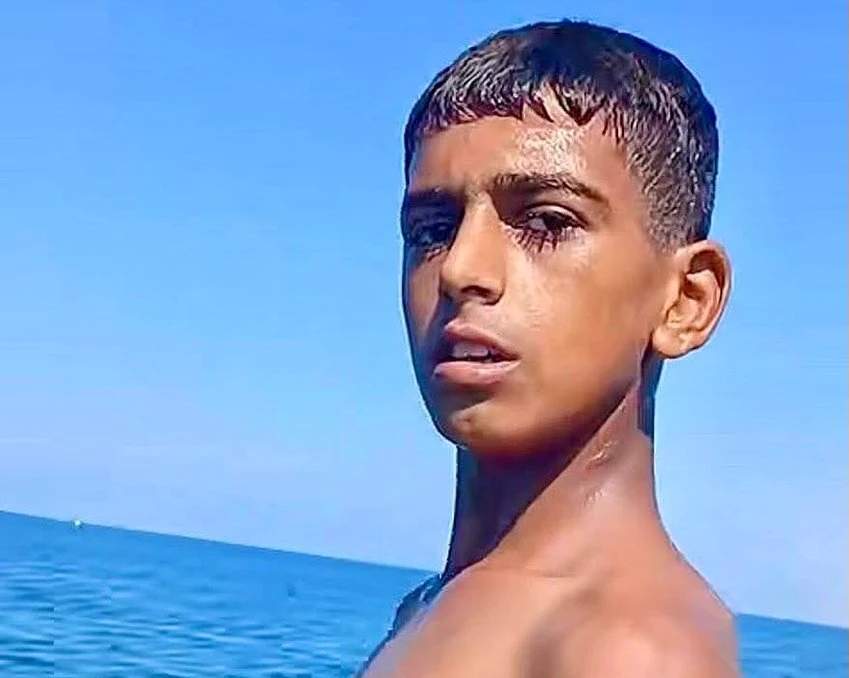 Young Palestinian fisherman Muhammad Musa Abu Giab, on the beach of Deir al-Balah in central Gaza.