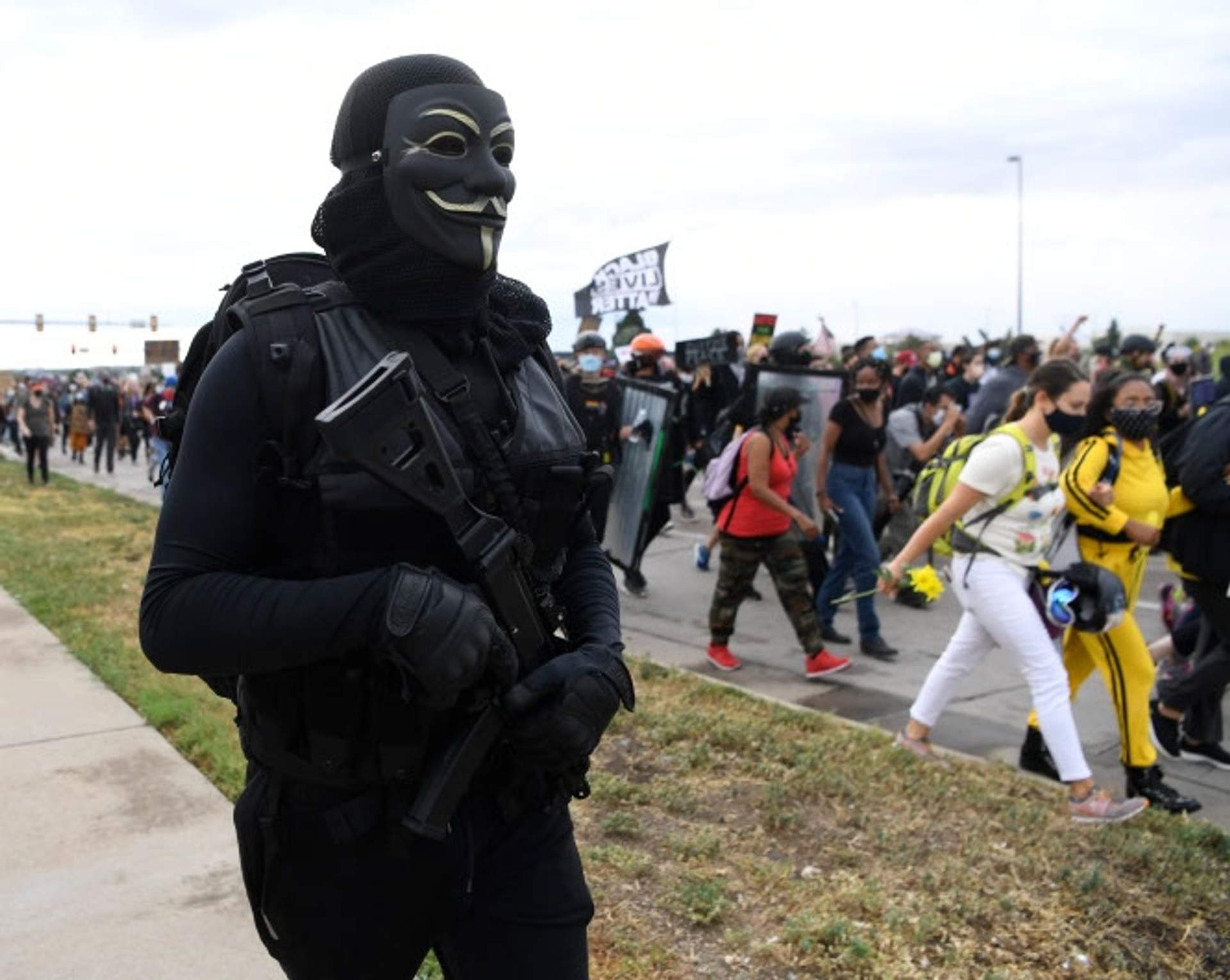 Armed Anonymous member marches down Alameda Ave towards I-225. NOT THE SHOOTER[Radical Edward - Untelevised Media]