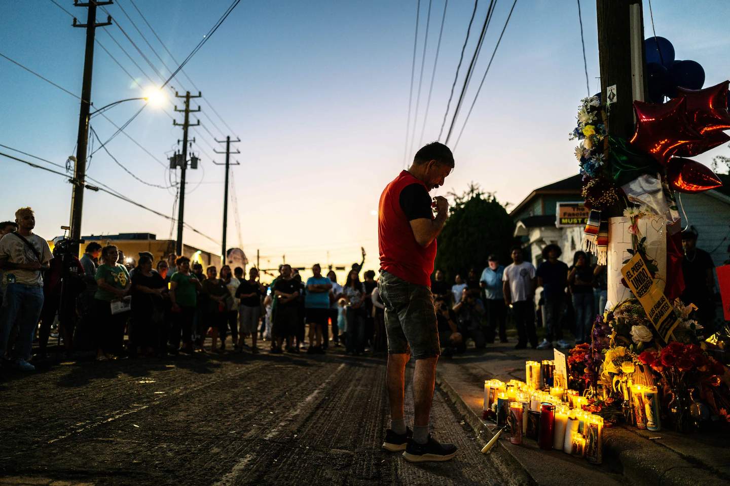 Community members honor Lorenzo Salgado Araujo at vigil.