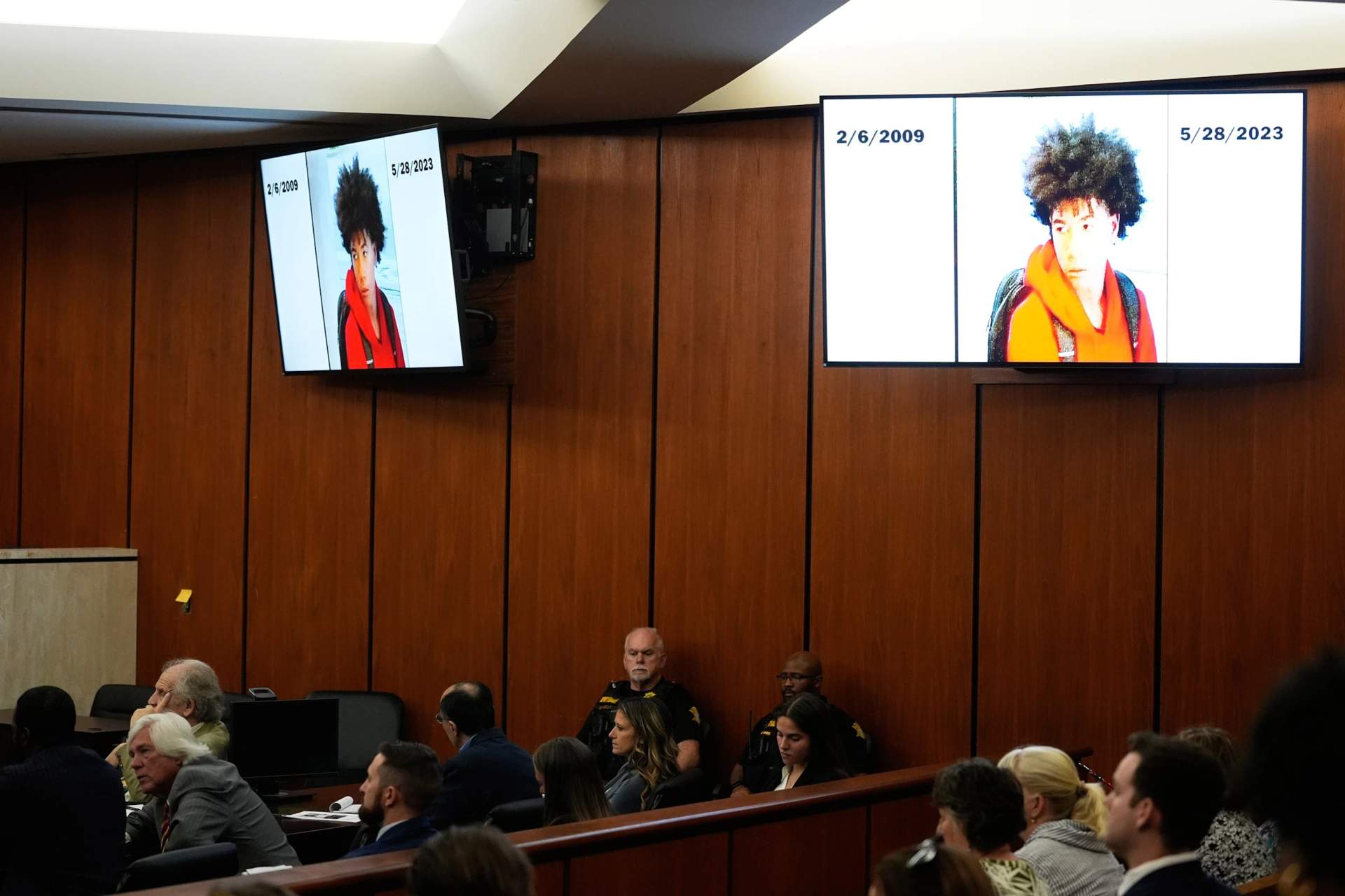 Courtroom photo showing an image of Cyrus Carmack-Belton displayed during the trial of Chikei Rick Chow