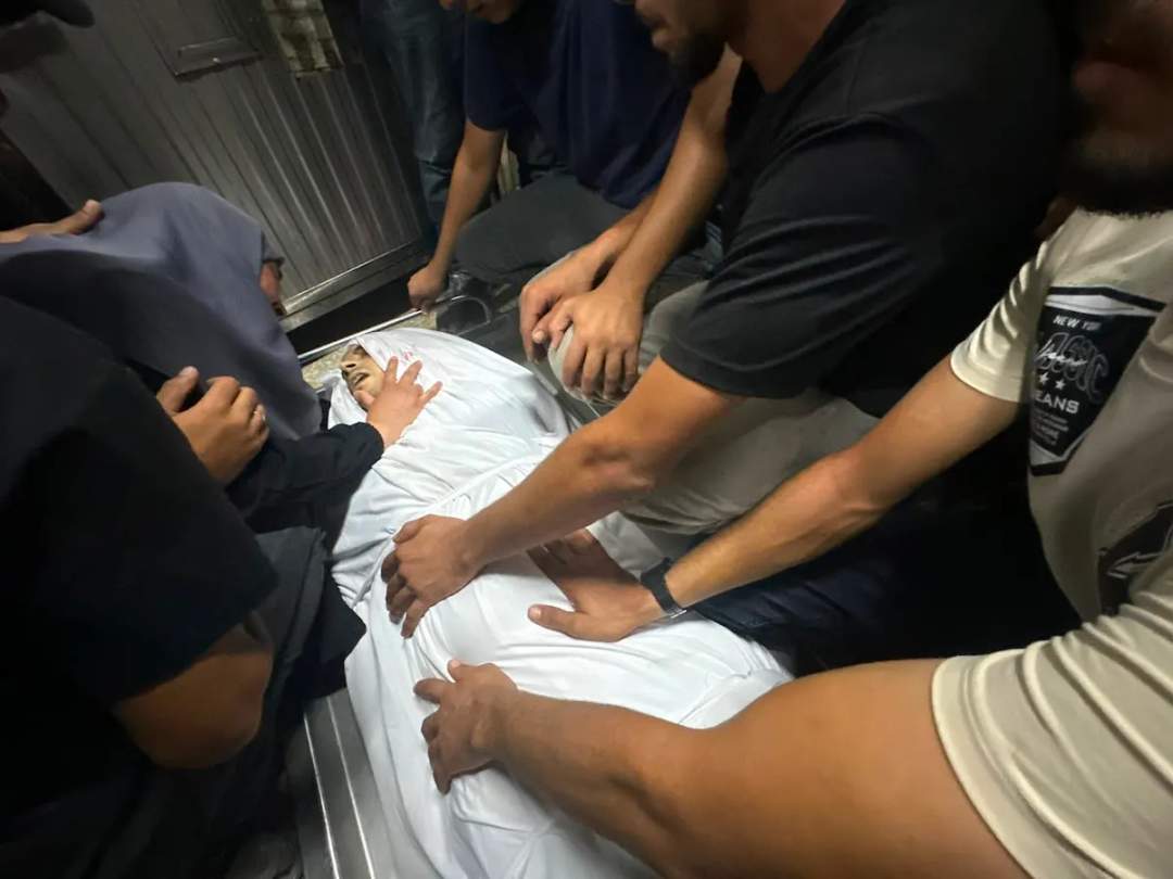 Palestinian civilians grieving at the site of an Israeli airstrike on a police station in Jabalia refugee camp, northern Gaza