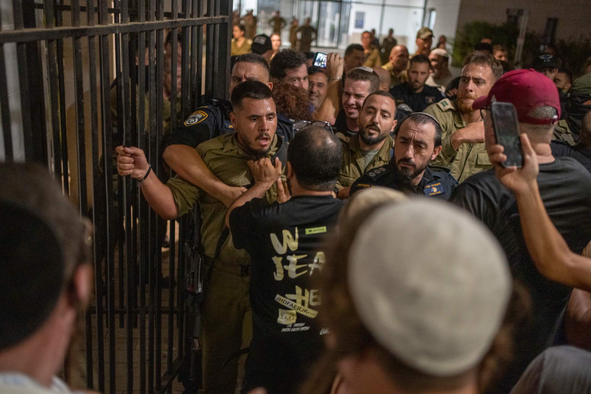 Israeli soldiers and police clashed with right-wing activists who broke into the Bayt Lid army base over the detention of reservists suspected of abusing a detainee after the Oct. 7 attacks, July 29, 2024.