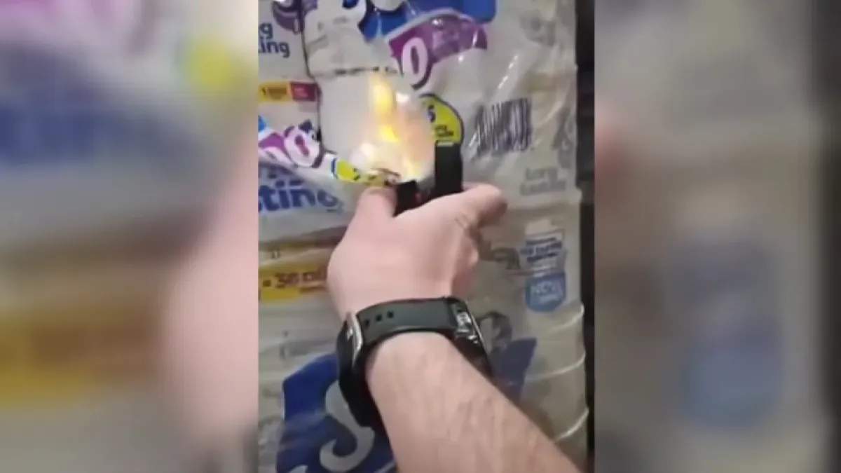Toilet paper rolls being set on fire with a zippo lighter.