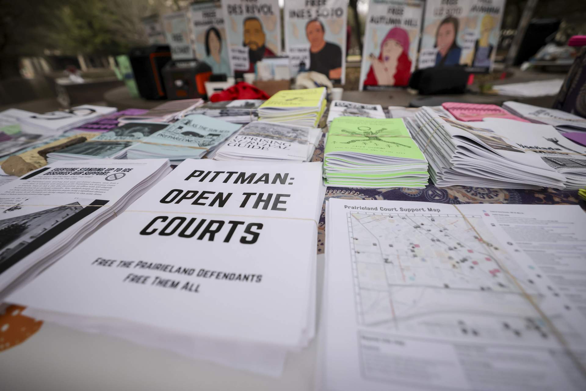 Supporters spread flyers outside the Prairieland ICE shooting trial at federal courthouse, Feb. 26, 2026