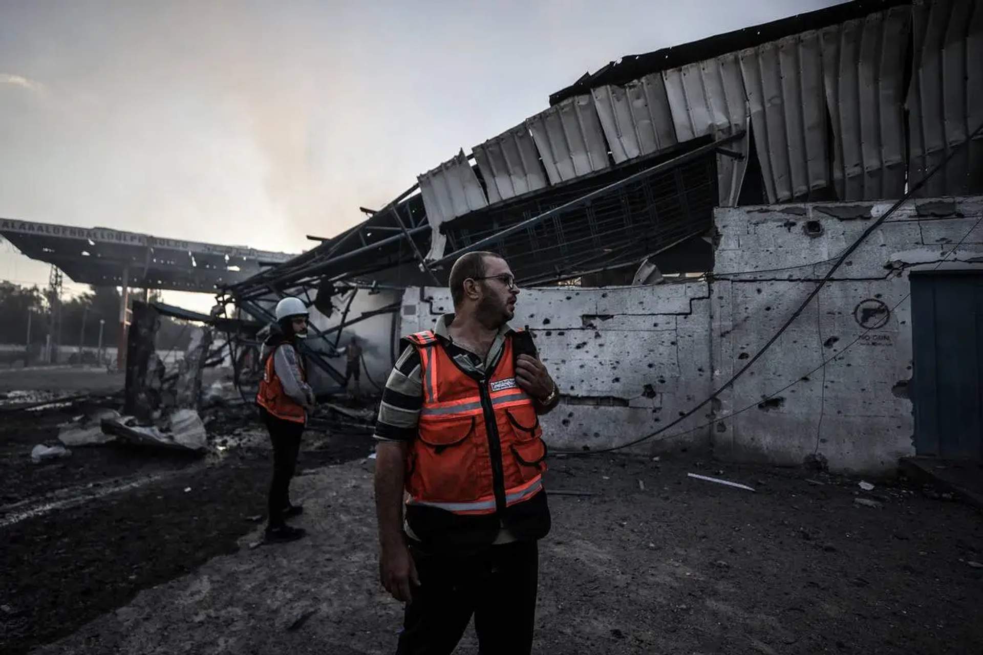 Firefighters intervene fire broke out at warehouse of UNRWA following Israeli bombardments on southern part of Gaza City, Tel al-Hawa neighborhood, Gaza on October 16, 2023. [Ali Jadallah – Anadolu Agency]