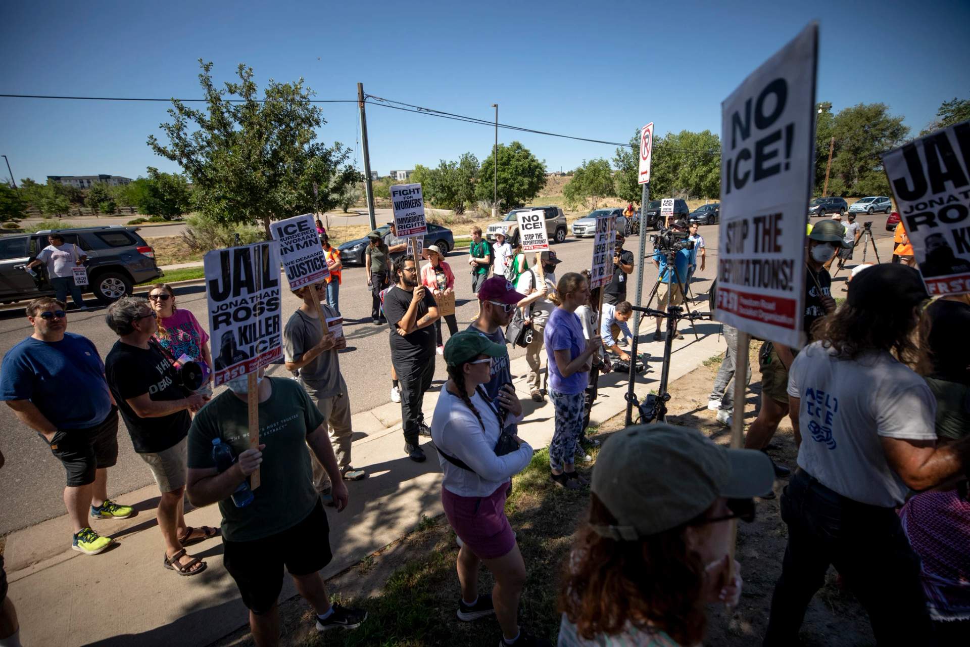 Demonstrators gather outside of U.S. Immigration and Customs Enforcement's Denver Contract Detention Facility, operated by GEO Group