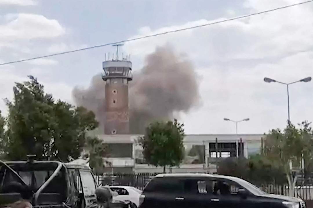Smoke rising near Sanaa International Airport runway after airstrikes on July 13, 2026