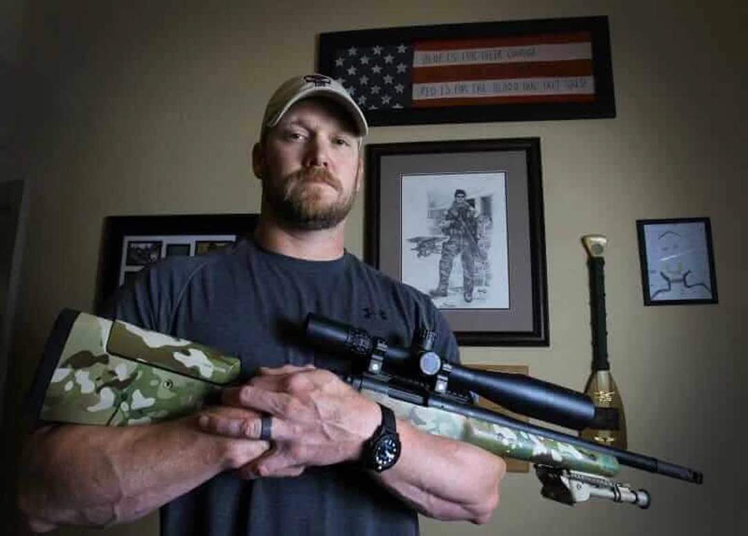 Chris Kyle, retired Navy SEAL, holding a sniper rifle in a 2012 file photo