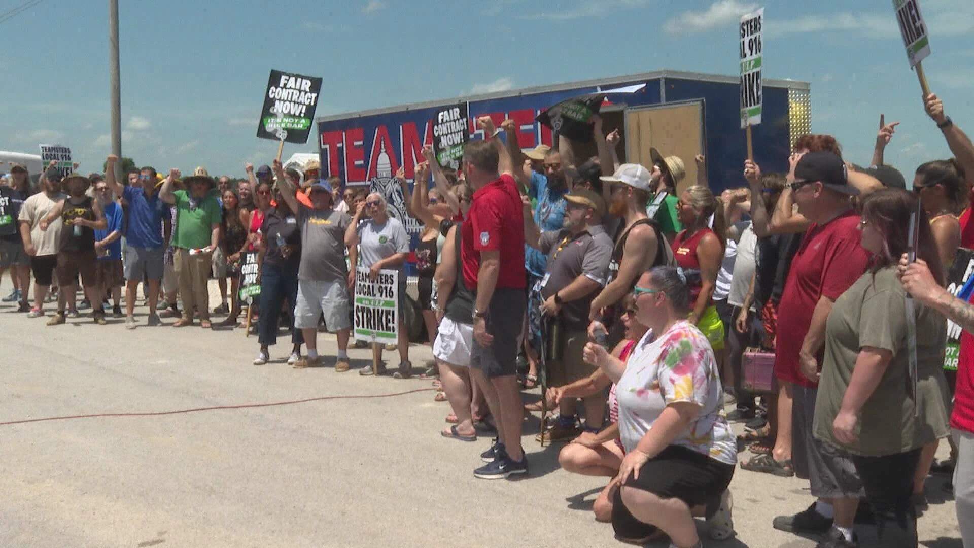 Striking Ascend Wellness cannabis workers rally on the picket line during the July heatwave in Barry, Illinois