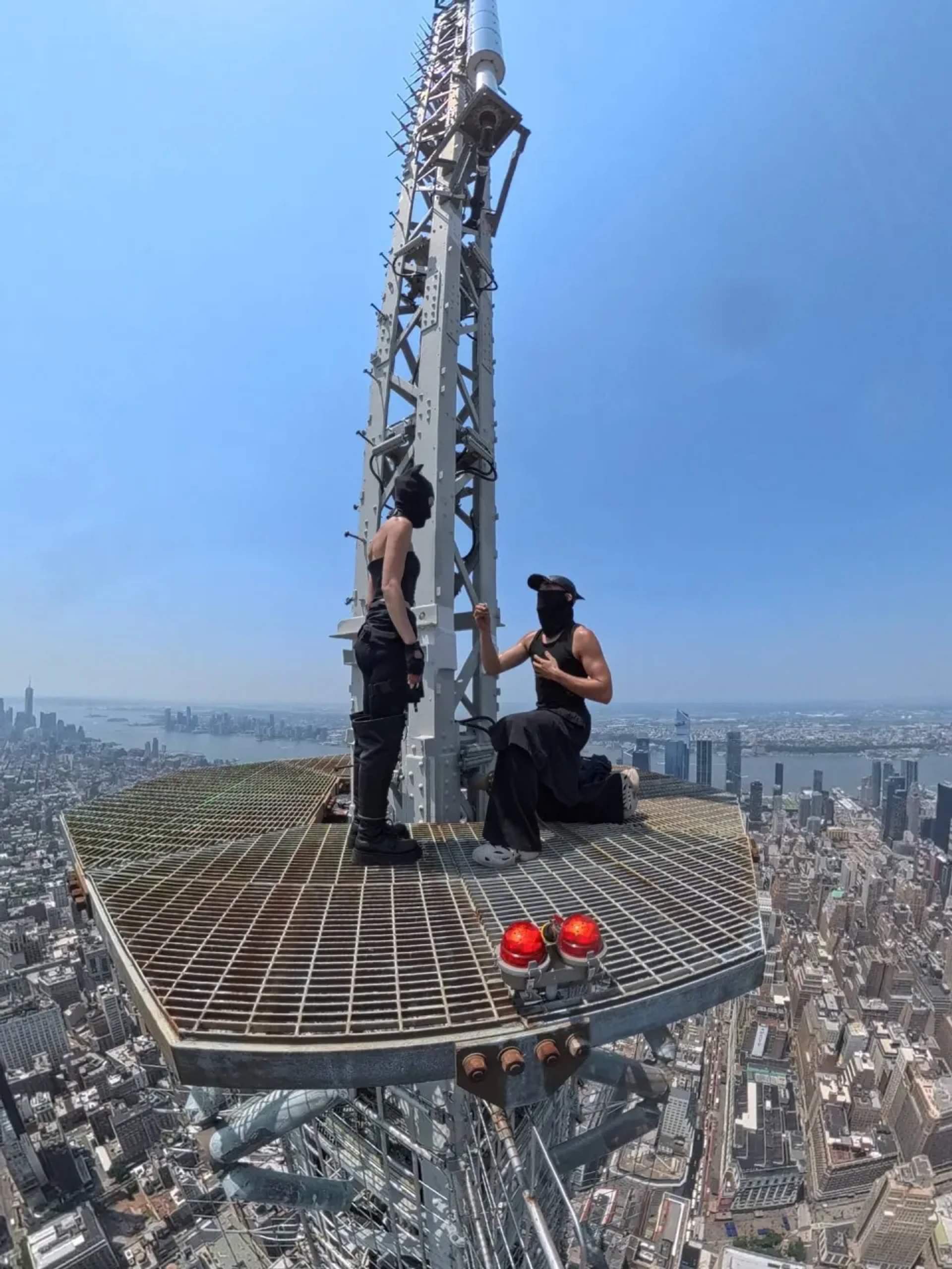 Ivan on 1 knee proposing to Angela 1500ft above Manhattan.