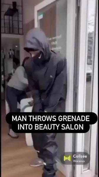 Screen shot of man preparing to throw a grenade into a beauty salon in France