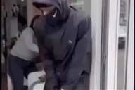 Screen shot of man preparing to throw a grenade into a beauty salon in France