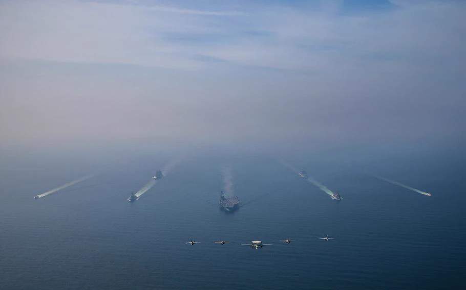 The USS Abraham Lincoln and Carrier Air Wing 9 transiting in formation at sea