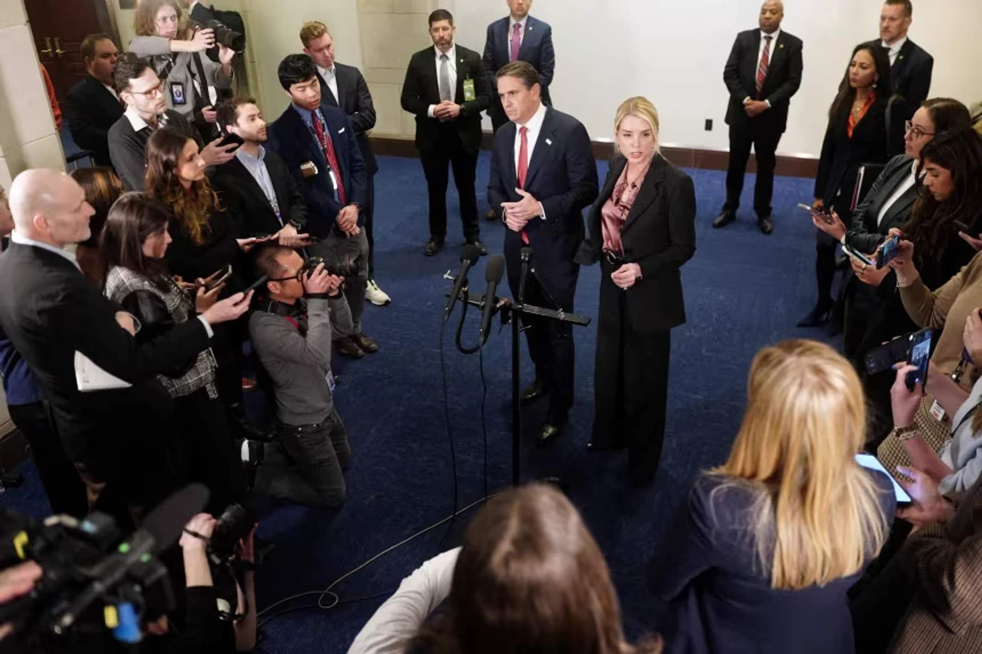 Attorney General Pam Bondi and Deputy Attorney General Todd Blanche speak to the media following a closed-door briefing on Capitol Hill in Washington, DC, on March 18, 2026.
