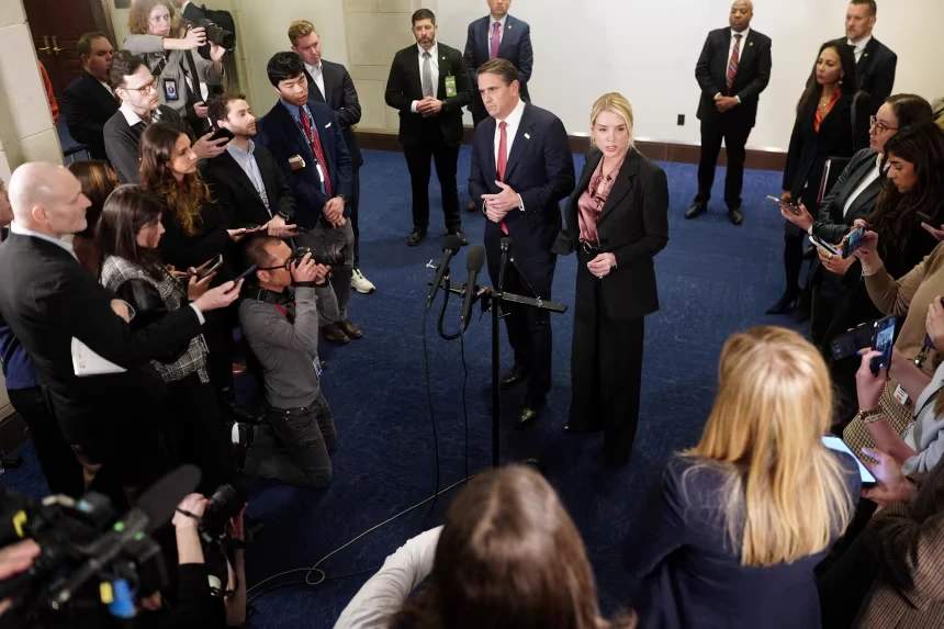 Attorney General Pam Bondi and Deputy Attorney General Todd Blanche speak to the media following a closed-door briefing on Capitol Hill in Washington, DC, on March 18, 2026.