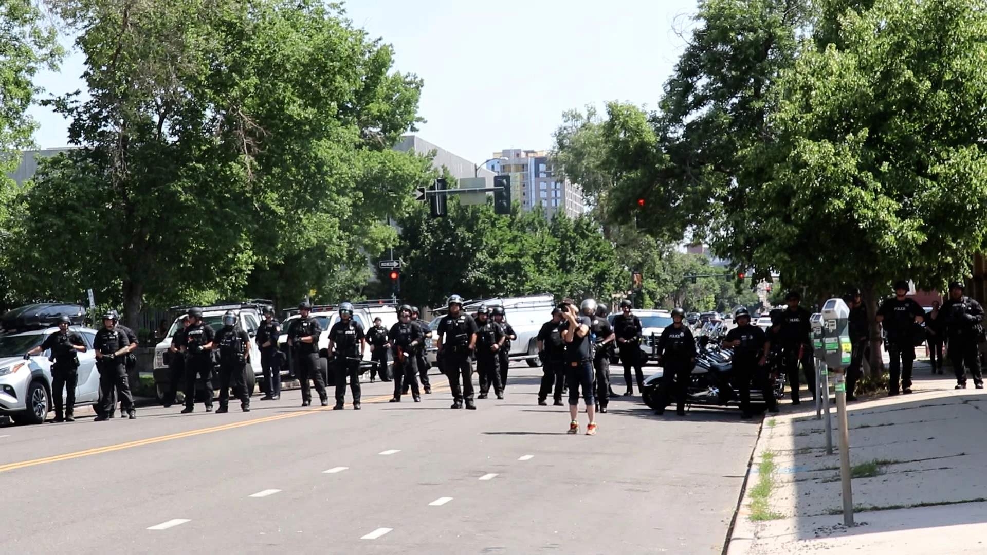 Counter-protesters pushed back from entrance to Civic Center Park as Denver Police protect the Police Appreciation Day event, July 18, 2021.