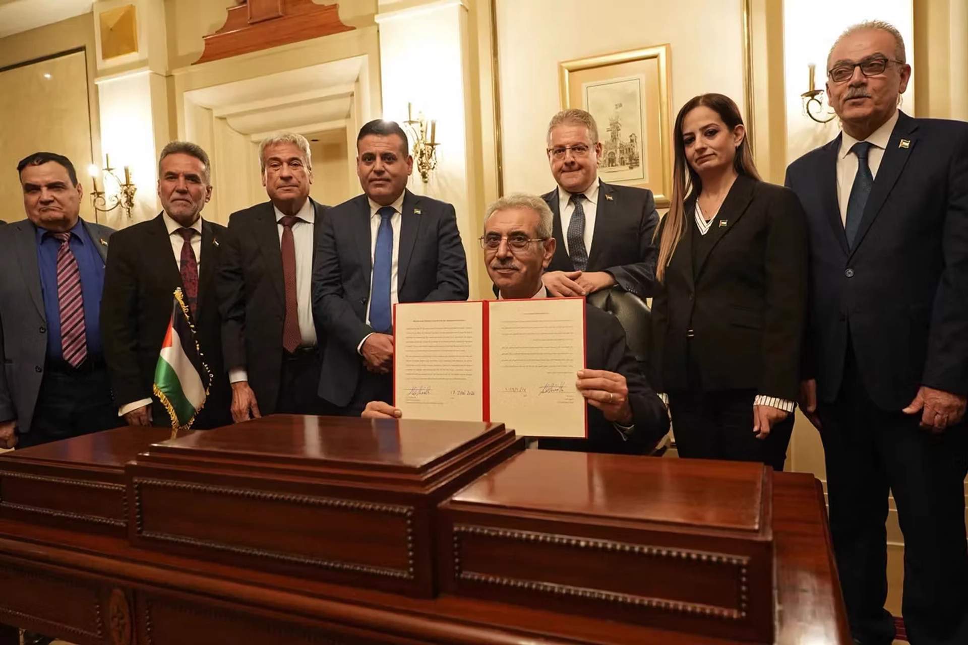 Ali Shaath (center), president of the National Committee for the Administration of Gaza, with members of the committee during the inaugural meeting of the body, in Cairo, on January 18, 2026