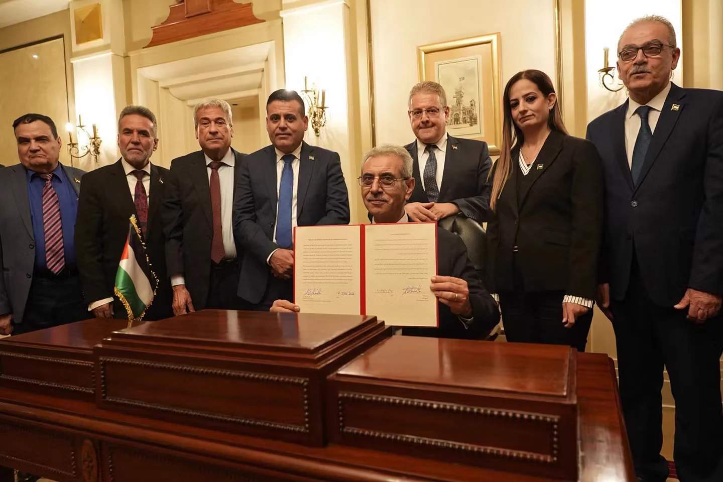 Ali Shaath (center), president of the National Committee for the Administration of Gaza, with members of the committee during the inaugural meeting of the body, in Cairo, on January 18, 2026
