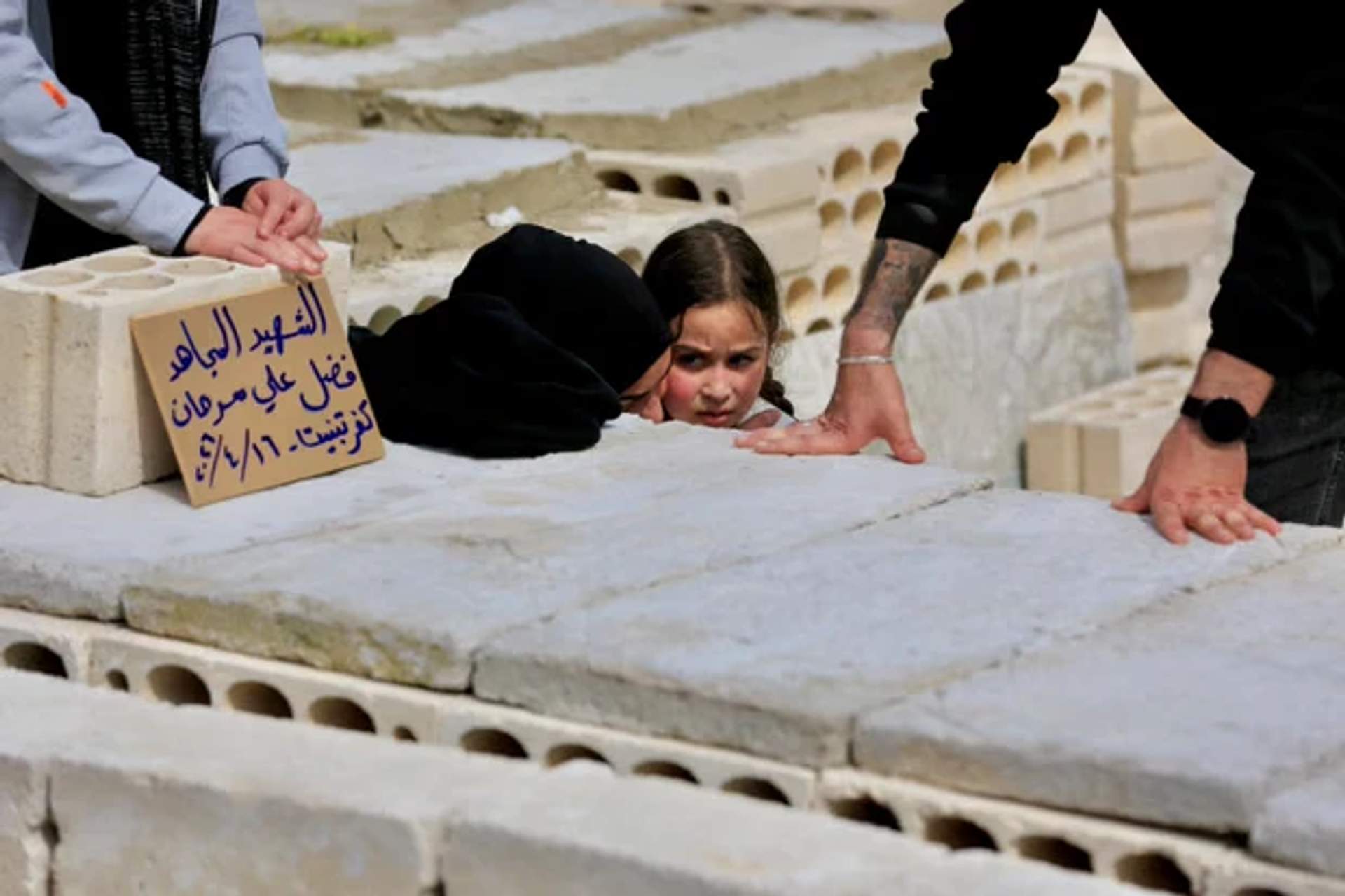 Mourners attending the funeral of Fadel Sarhan in Haret Saida, southern Lebanon.