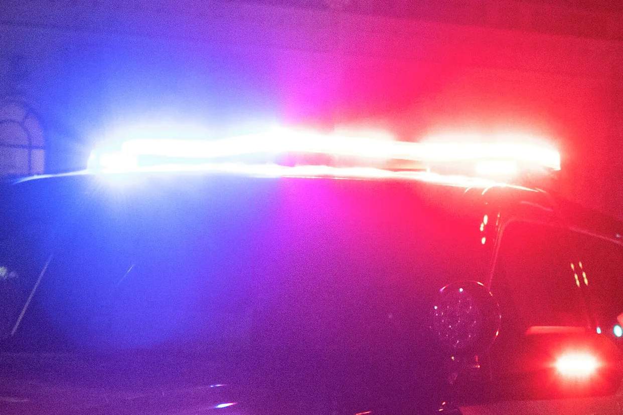 San Francisco police officers and vehicle at the scene of an alleged shooting near Sam Altman's Russian Hill residence on April 12, 2026