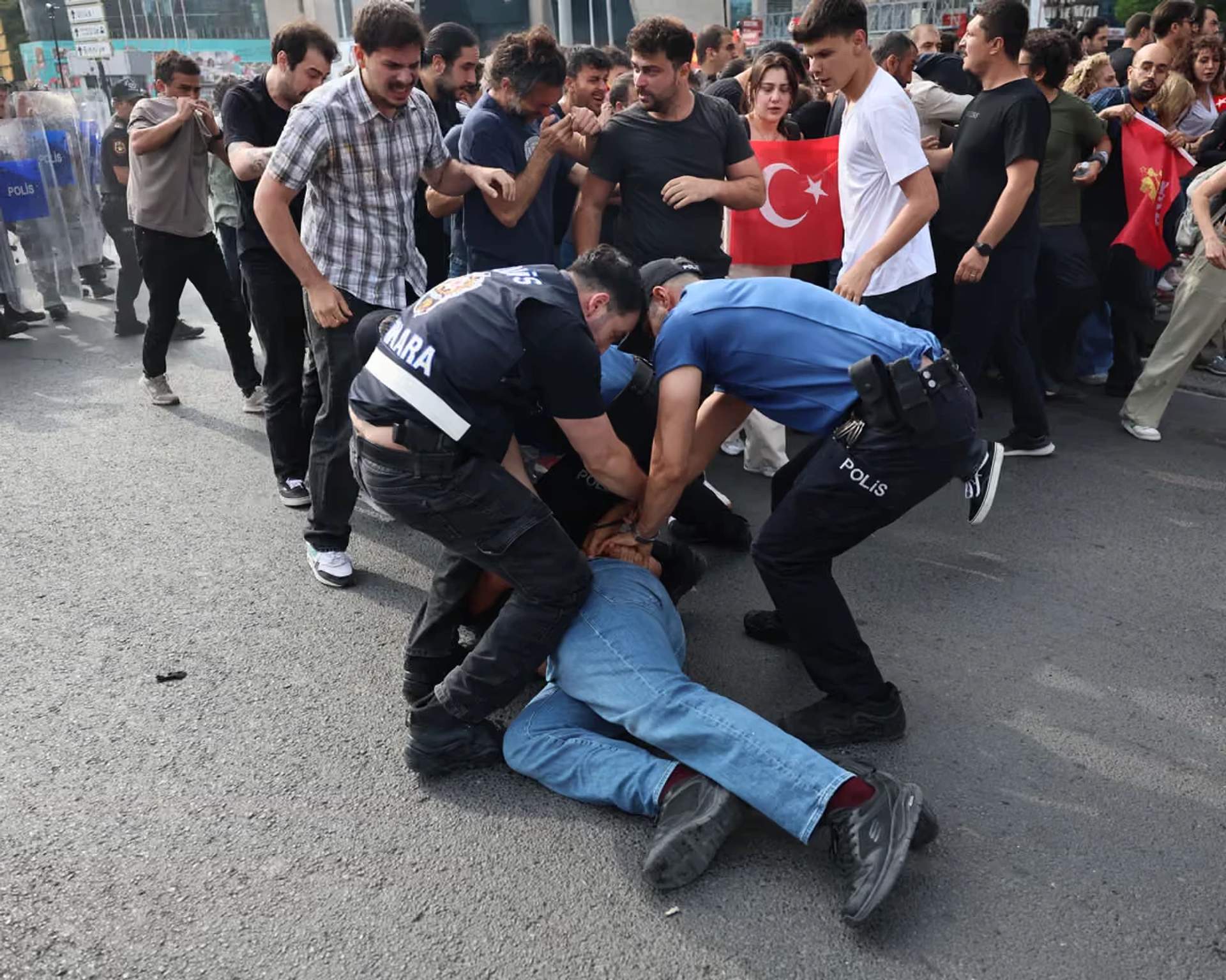 Turkish police detaining a demonstrator during an anti-NATO protest in Ankara on July 5, 2026