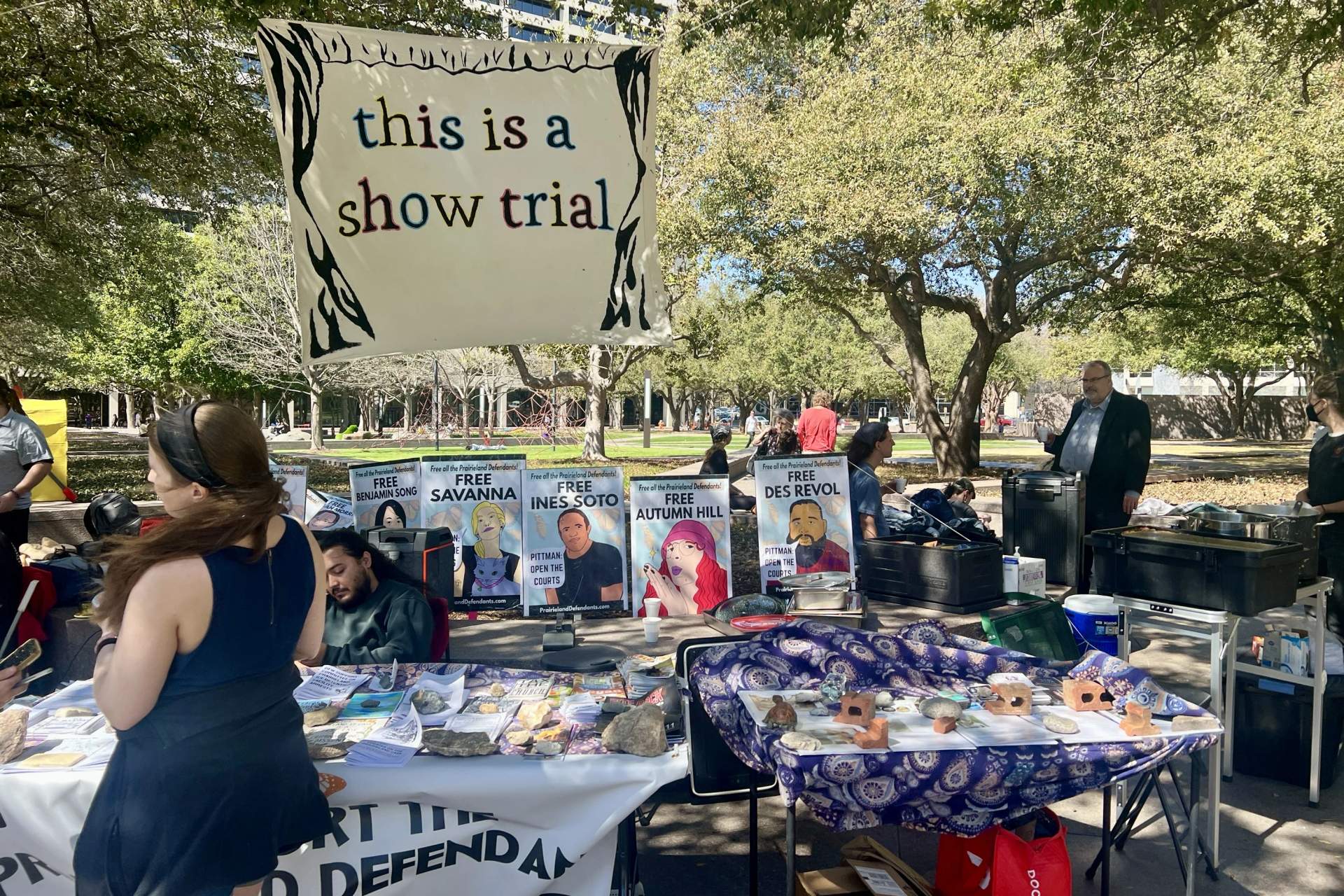 "This is a show trial" Banner displayed at protest outside the federal courthouse.