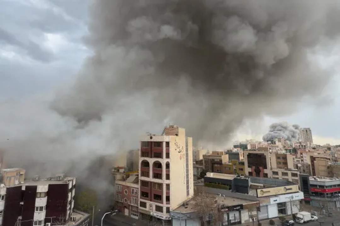Smoke and explosion plumes rising over the Tehran skyline during Operation Epic Fury airstrikes on February 28, 2026