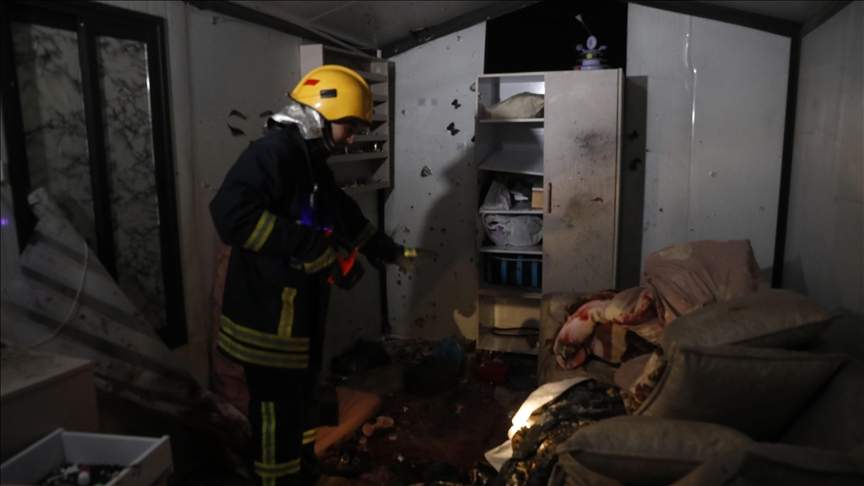 4 Palestinian women killed in West Bank by debris from projectile, a rescue worker searches the rubble of the salon.